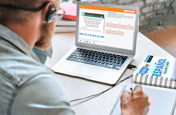 Spanish textbook for beginners combined with digital tools for interactive learning